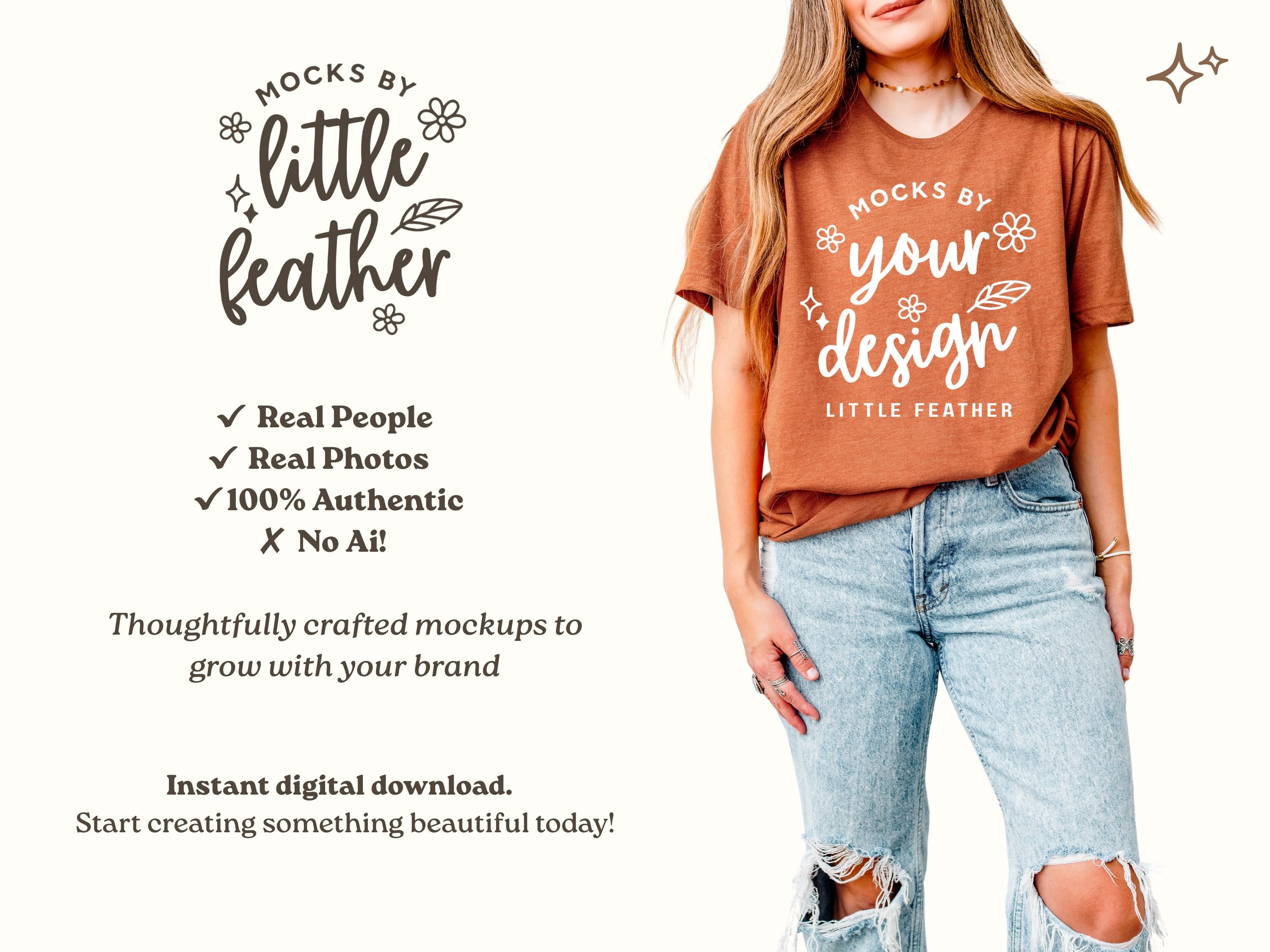 Rust boxy crop T-shirt with "little feather" graphic, worn with blue jeans